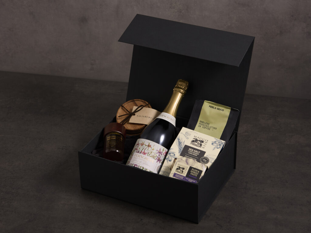 Large custom rigid hamper box crafted from eco-friendly crushed agro-industrial waste paper for high-end gifting.